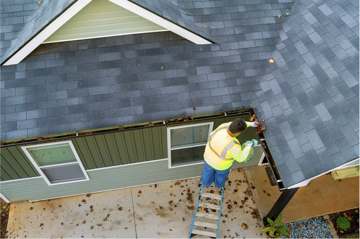 Aerial view of professional gutter cleaning on a Yonkers residential roof